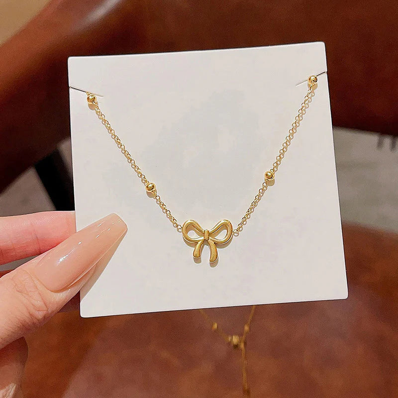 Bow Pendant Necklace with Beaded Chain